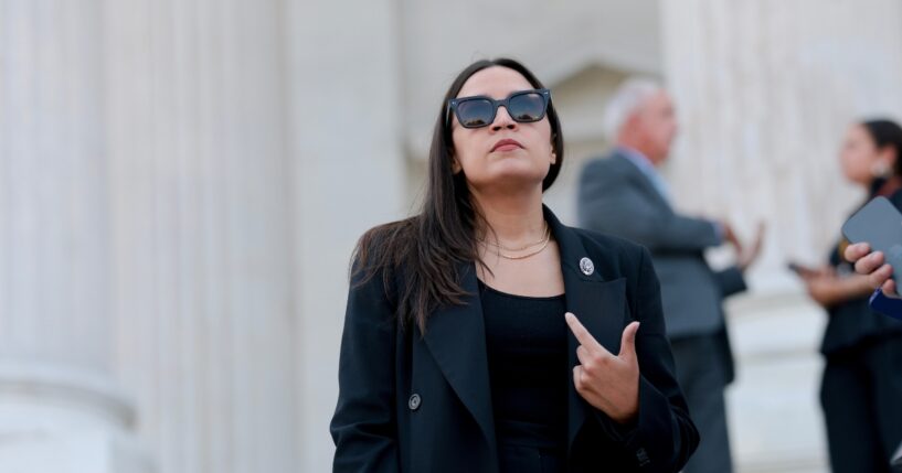 Rep. Alexandria Ocasio-Cortez speaks to reporters on the House steps after a series of votes at the U.S. Capitol on July 22, 2026, in Washington, D.C.