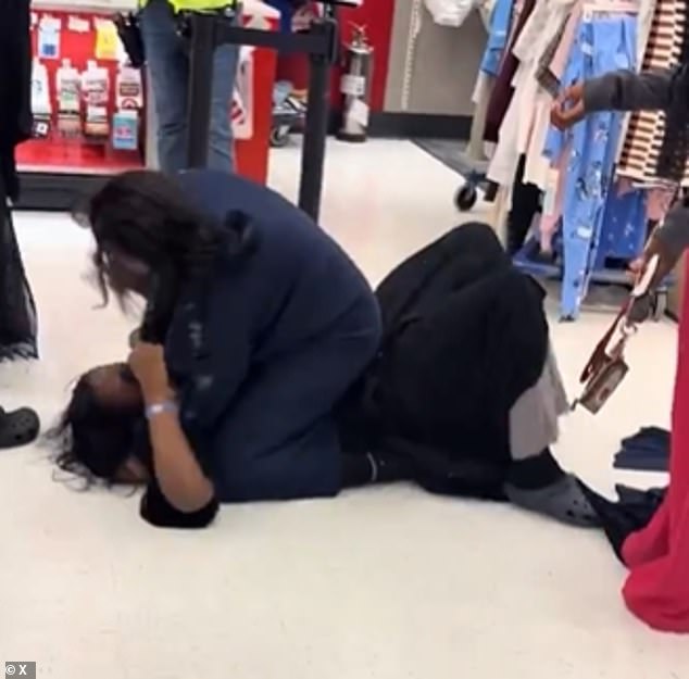 The two women could be heard shrieking as their hijabs lay on the ground while they tried to rip out each other's hair