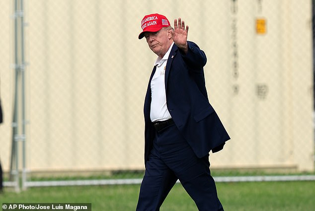Trump walks from Marine One to his limousine upon his arrival at the White House on Sunday
