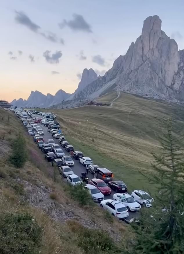 The swarm of tourists have caused carnage in the quaint village and has seen the region implement new restrictions that limit cars to just 150 per day
