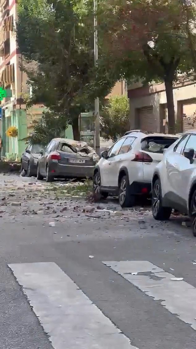 The roof of another car crushed by falling debris from the earthquake