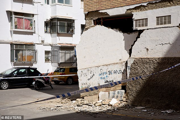 A damaged wall of a building is cordoned off in the aftermath of the earthquake