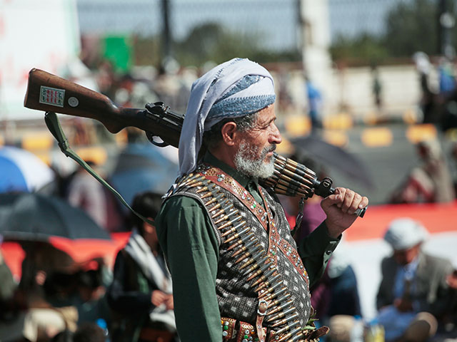 Title: Israeli airstrikes continue across Gaza and other top photos from the Middle East Image ID: 26288648754622 Article: A supporter of Yemen's Houthi rebels carries his rifle during a rally in support of the group in Sanaa, Yemen, Friday, Oct. 9, 2026. (AP Photo/Osamah Abdulrahman)