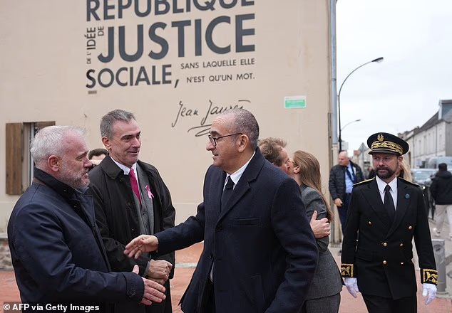 France's Interior Minister Laurent Nunez (pictured, centre) visited the scene of the deadly shooting on October 23, 2026