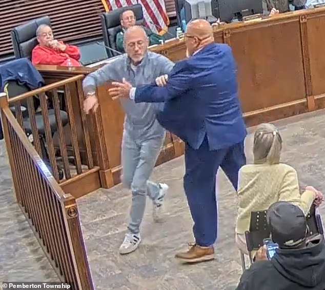 Mayor Bianchini is seen leaving his seat after pointing his finger towards the resident, identified as Michael Sawka, and charging across the room to the public gallery