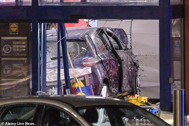 Man in his 30s dies as car crashes into busy Lidl store after 'woman behind the wheel suffered medical incident'