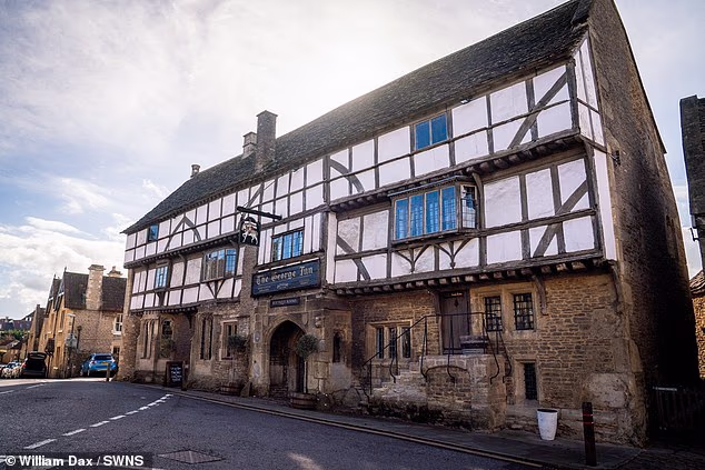 Cheers! England's oldest pub is finally named as experts confirm 'national treasure' boozer started pulling pints 600 years ago after studying tree rings in timber frame