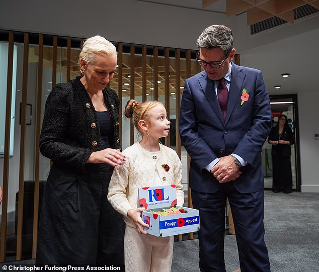 Prime Minister Andy Burnham and his wife Marie-France van Heel met poppy appeal collectors and armed forces veterans at No 10 North yesterday
