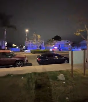 The lights of two police cruisers are seen here in pursuit of the boy