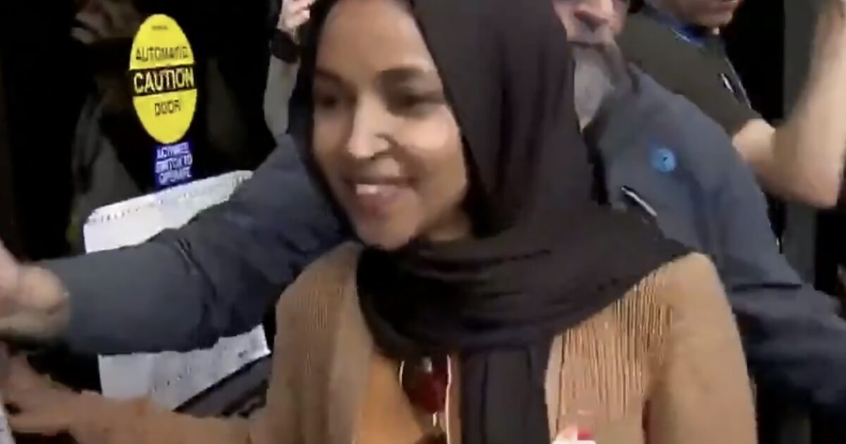 Ilhan Omar’s Handlers Rush Her Away from the Press as She Remains Defiant Amid Questions About Federal Investigations (VIDEO)