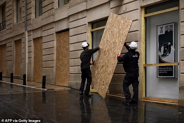 France braces for day of far-Left chaos: Shopkeepers and terrified civilians arm themselves ahead of rioting and looting expected in Paris when protests return tomorrow