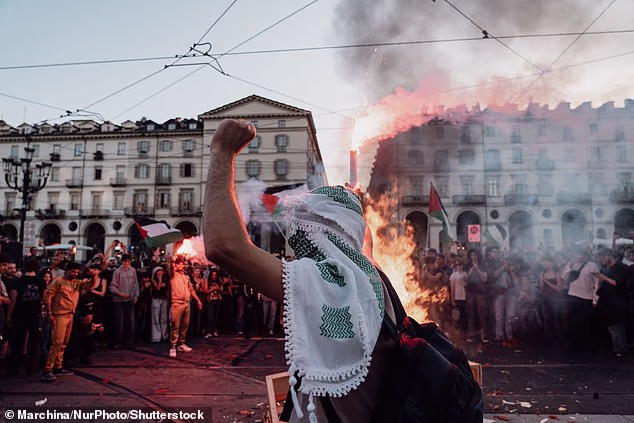 Thousands of pro-Palestinian protesters march in a rally in support of Gaza in Turin, Italy, on October 10