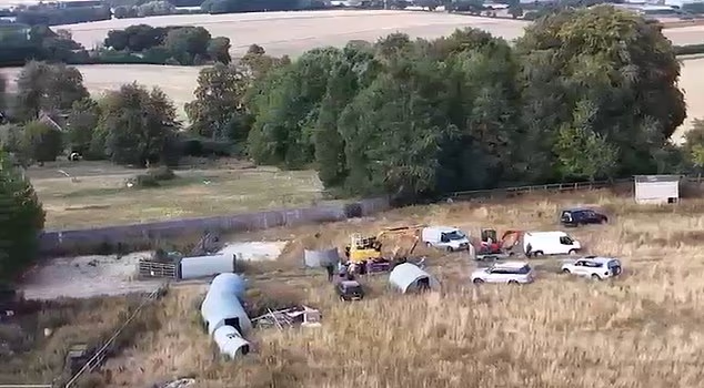 Video footage shared with the Daily Mail shows diggers and vans being driven onto the site before the work began
