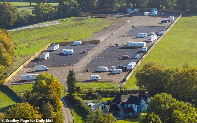 Our village is being terrorised by balaclava-clad travellers: Million-pound homeowners 'don't feel safe going outside' after group bulldozed field and moved in with caravans right next door