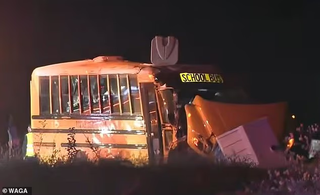 School bus carrying Georgia high school football team overturns on busy highway in terrifying crash... as nearby hospitals brace for potential 'mass casualty event'