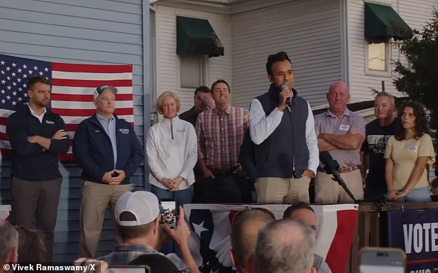 Vivek Ramaswamy's backyard rally gets unexpected backdrop as next-door neighbors wave signs blasting his Amy Acton ad