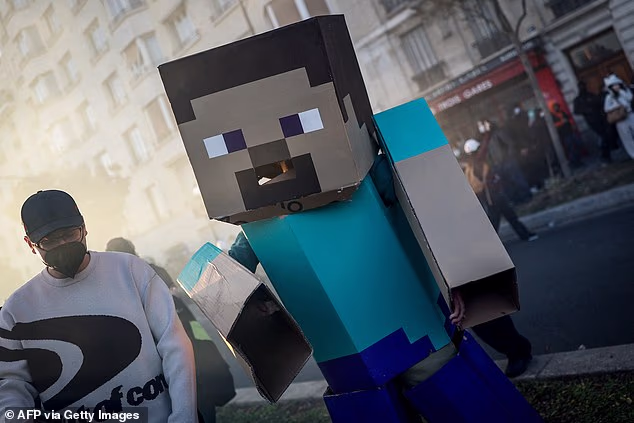 A person wears a lego costume made with cardboard in tear gas smoke