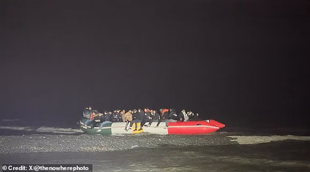 A migrant dinghy, pictured off the Belgian coast early on Thursday morning, was in the distinctive colours of the Kurdish flag