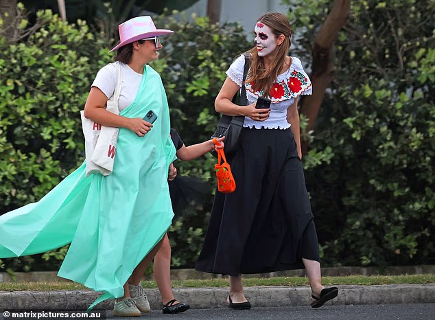 Ardern's friend also got into the spirit with her own colourful outfit