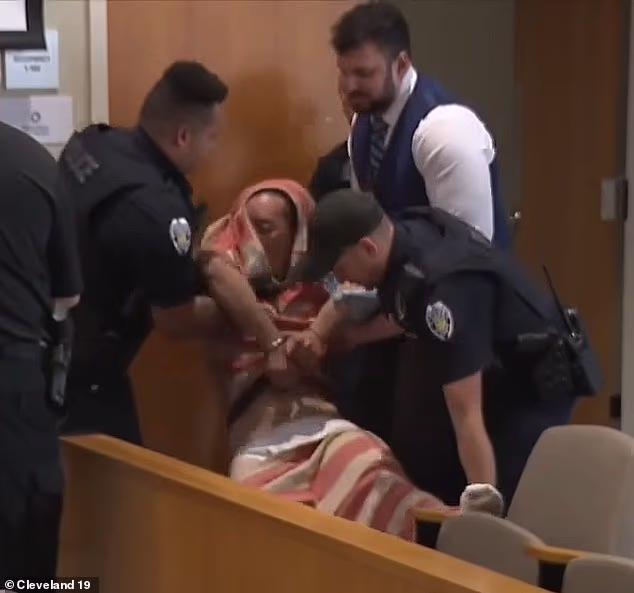 Asia, 31, was seen being carried into court with his jail-issued pants around his legs on Friday