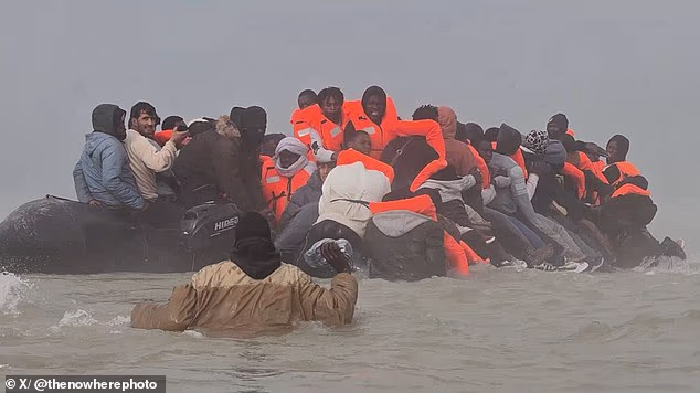 Dozens can be seen desperately toppling onto others already inside but are fought off