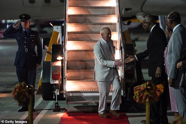 King Charles III is welcomed by the Governor-General of Antigua and Barbuda, Sir Rodney Williams
