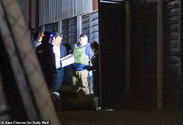 One shocked police officer recoiled and exclaimed 'Ay cabron' ('Oh damn') at the storage locker's contents, which the Daily Mail reported to the FBI
