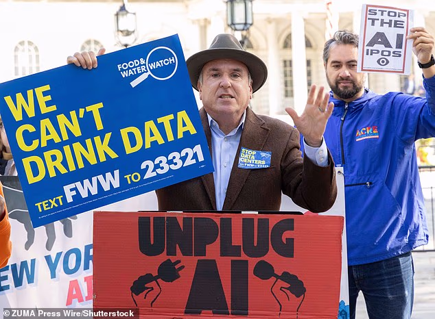 Campaigners from Food & Water Watch hold anti-AI signs as they protest in New York ahead of a hearing on the dangers of AI with representatives from Anthropic, OpenAI, Google and Meta